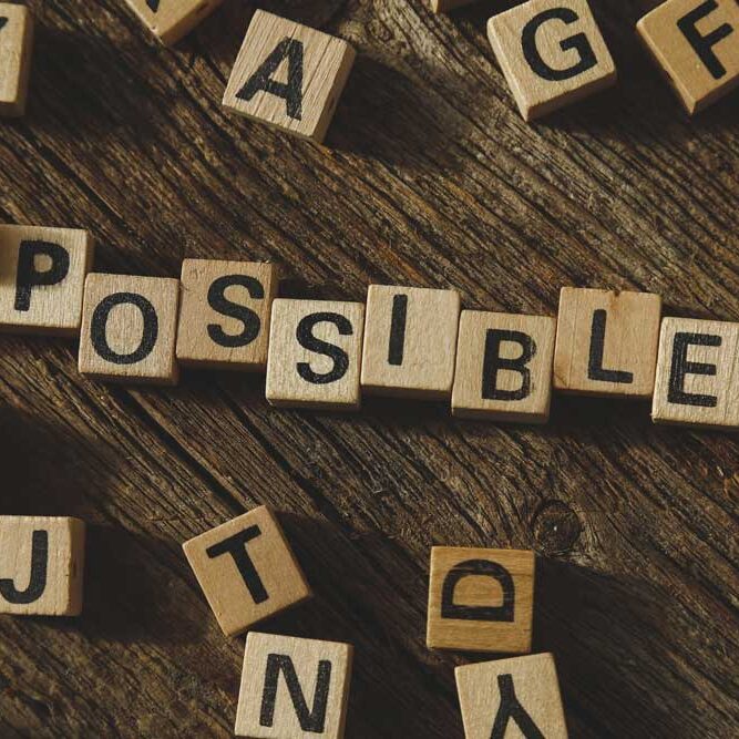 Blocks spelling out the word POSSIBLE